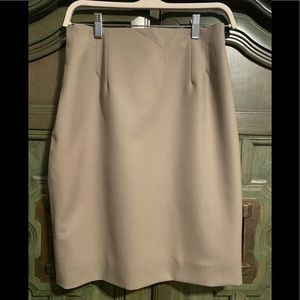 Ladies mini pencil skirt. Warstad wool with lining. Back zip, back slit. Size 8